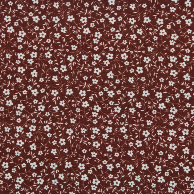 Tissu Coton imprimé fleur de lys beige sur fond marron